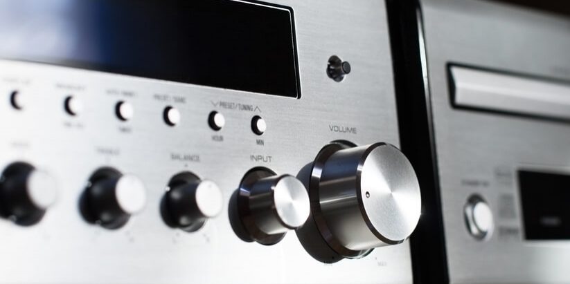 Front of home Hi-Fi Very shallow depth of field. Focus on Vol knob and right side of display.